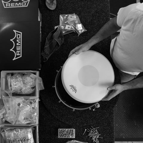 Evetts drums craftsman assembling handcrafted bespoke snare drum with remo drum heads