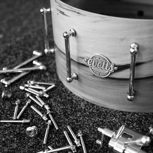 Evetts handcrafted bespoke snare drum during assembly tube lugs, trick throw off